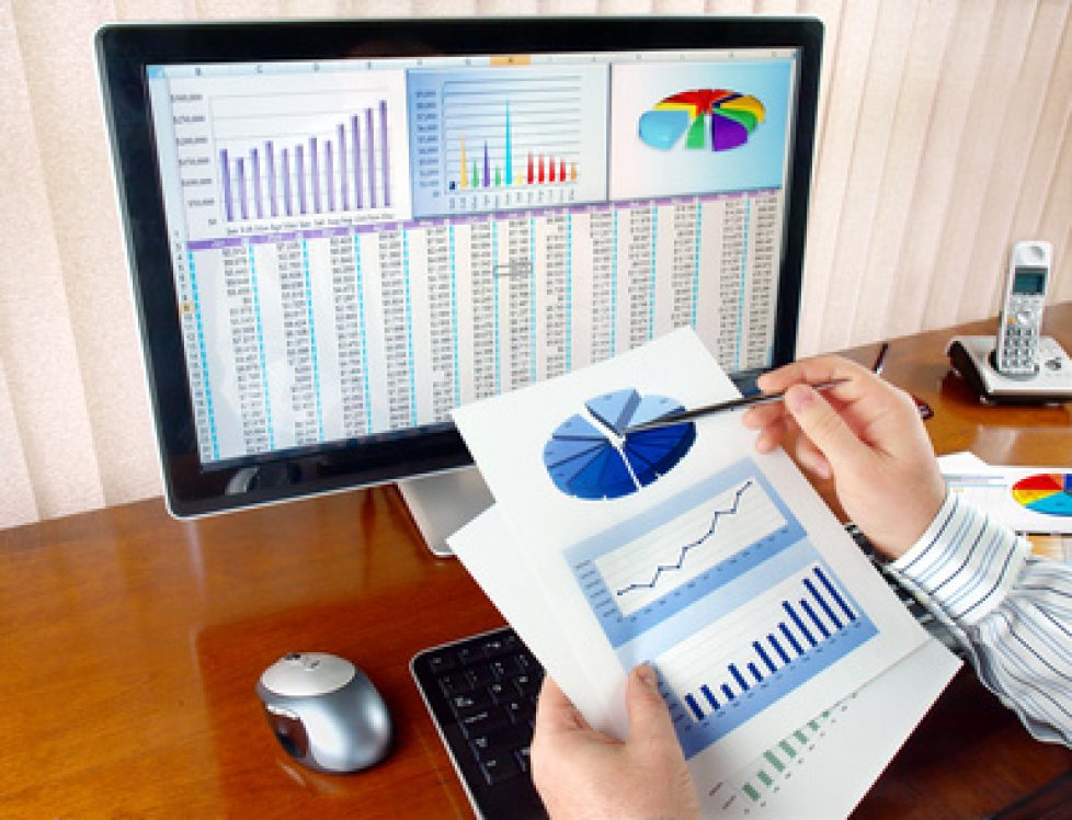 Businessman analyzing investment charts at his workplace