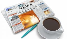 Coffee cup with newspaper