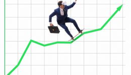 Businessman riding skateboard on financial graph